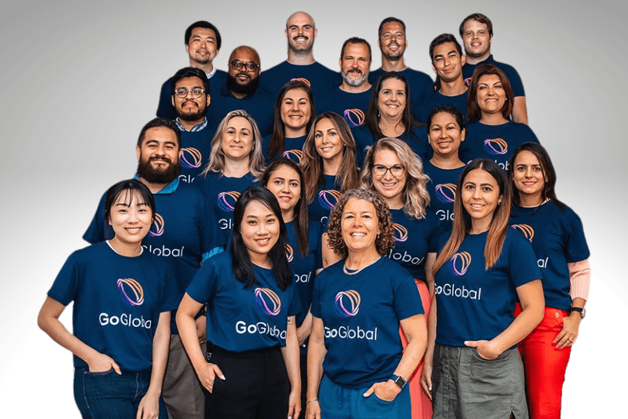 a group of employees posing wearing GoGlobal tshirts