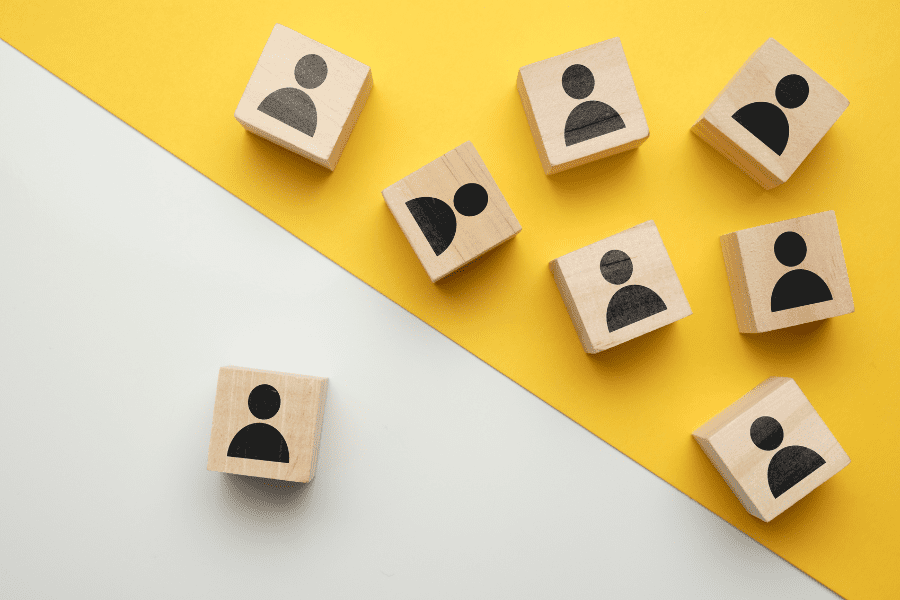 wooden blocks with abstract people representing employees