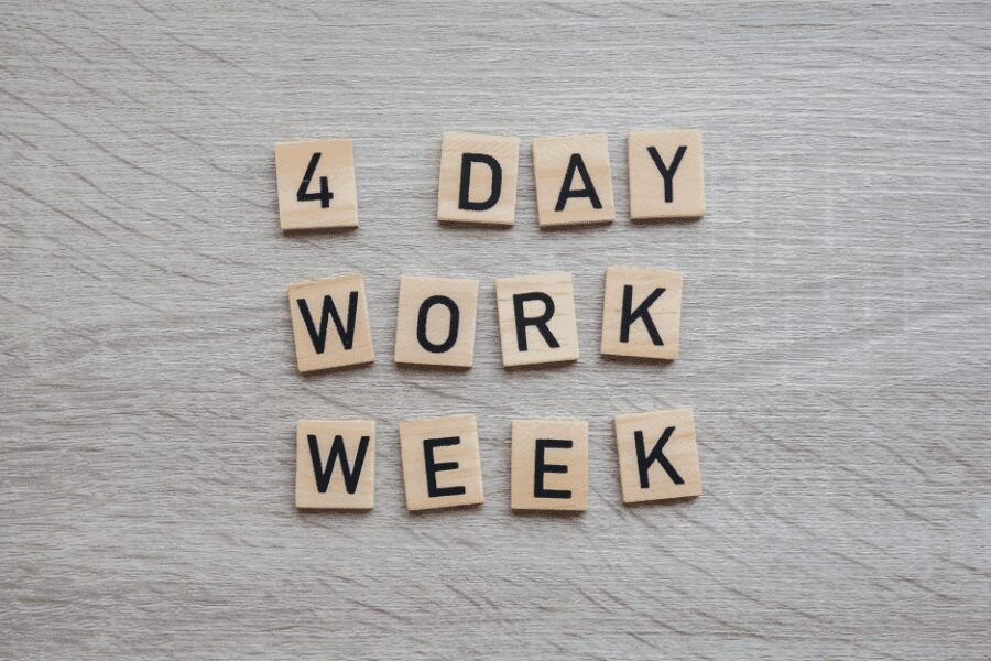 four day work week spelt out on wooden blocks