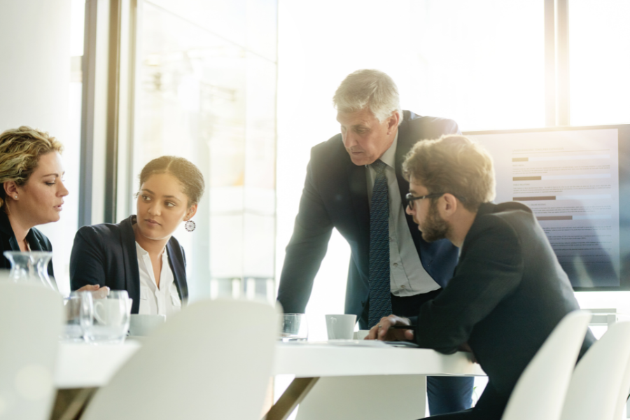 four non-profit employees in a meeting