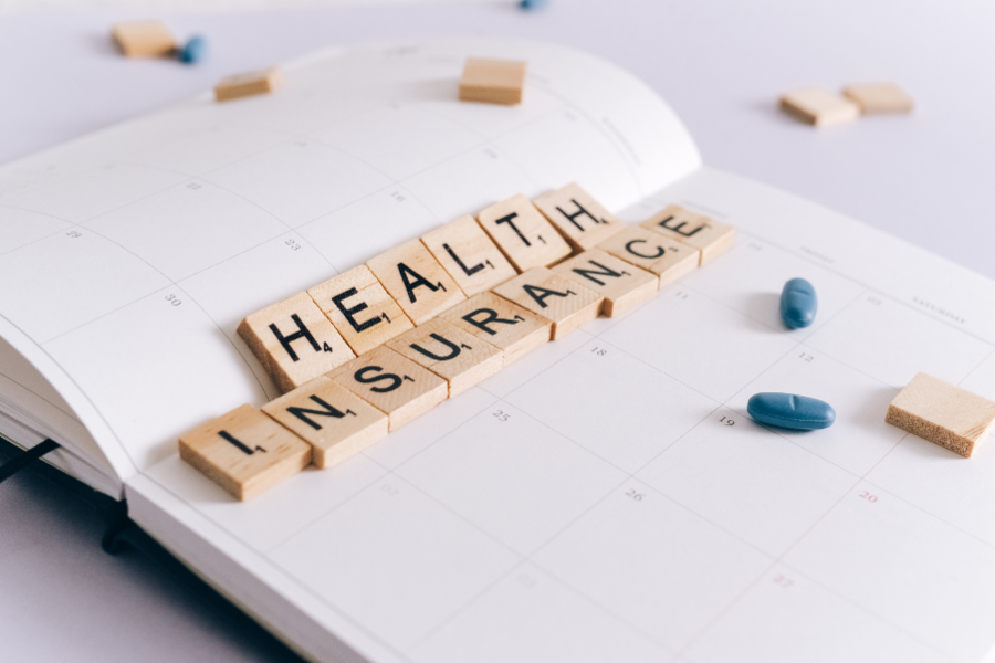 health insurance scrabble tiles placed on a planner