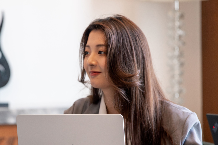 a female Asian employee smiling