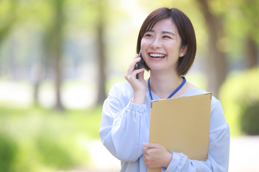 female Japanese employee talking on the phone