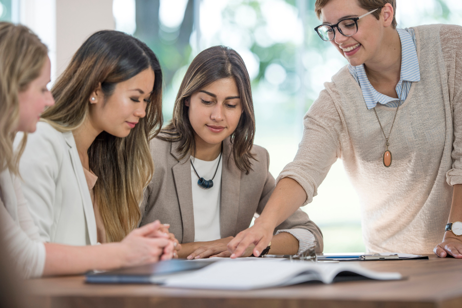 an HR manager discussing non-compete agreements with three colleagues