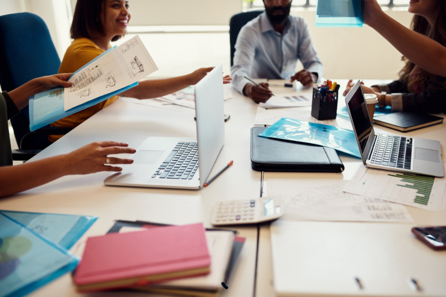 four colleagues working together at a table