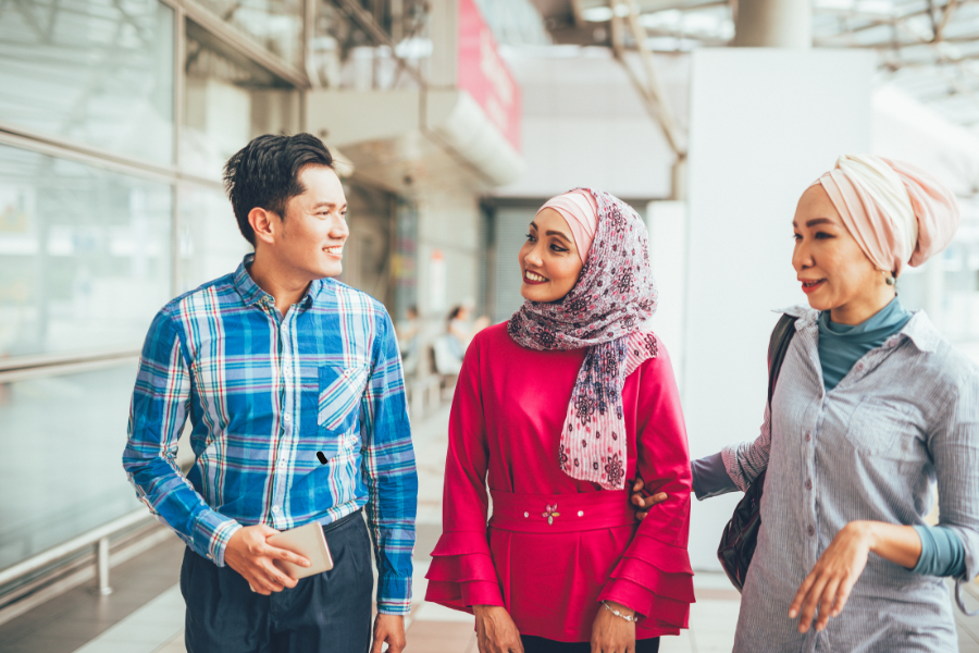 three business people in Malaysia networking