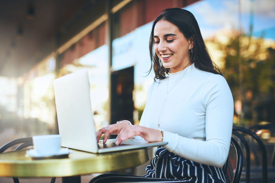 a woman working remotely from a coffee shop