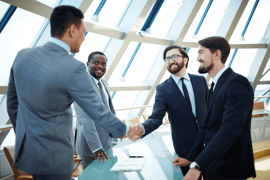 businessmen shaking hands for local partnerships in Africa