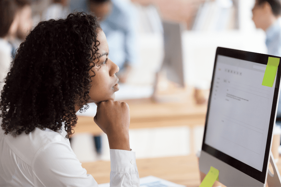 thoughtful female employee thinking about mergers and acquisition deal