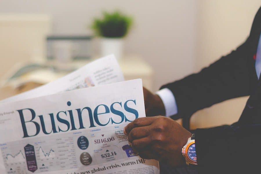 a person holding a newspaper