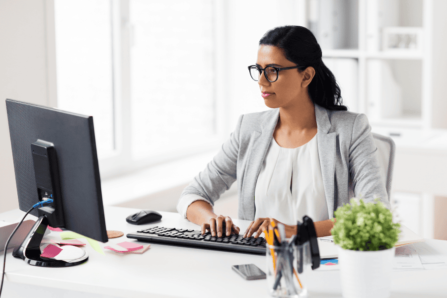 a female independent contractor working at her desk