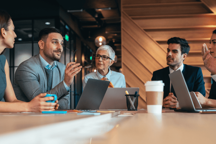 a group of professionals discussing opening an entity