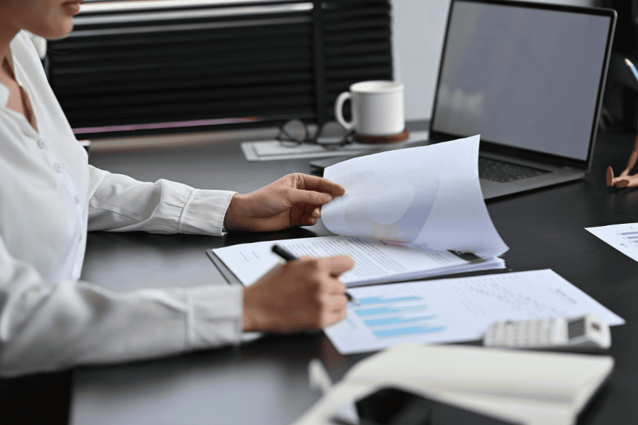 businesswoman's hand opening a banking document