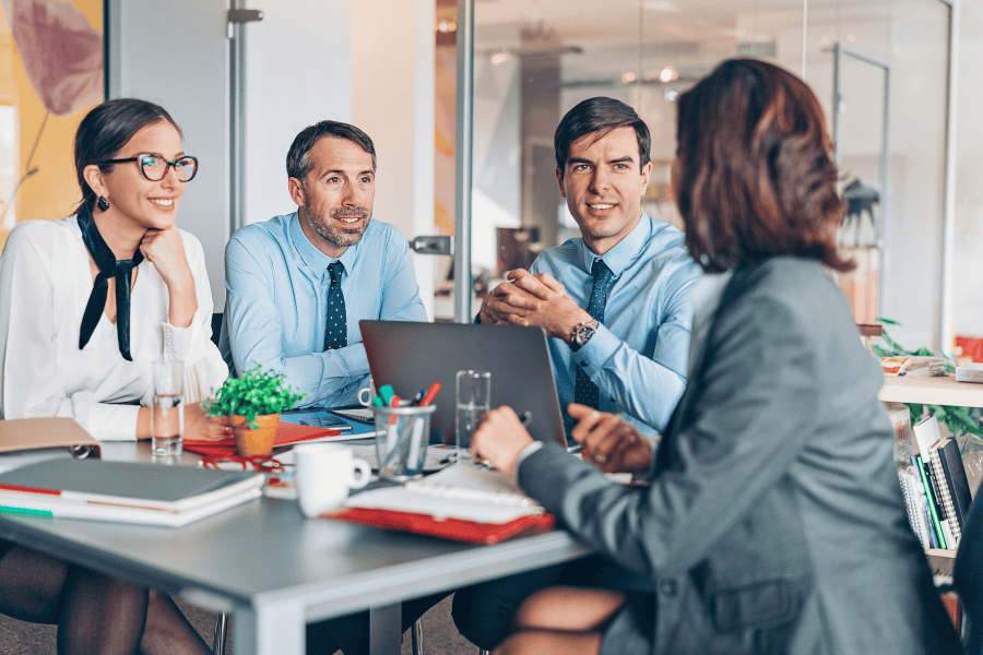 four professionals discussing entity management in Germany