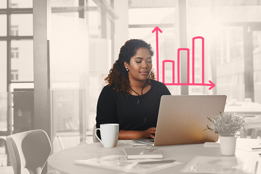 A professional woman is working on a laptop.