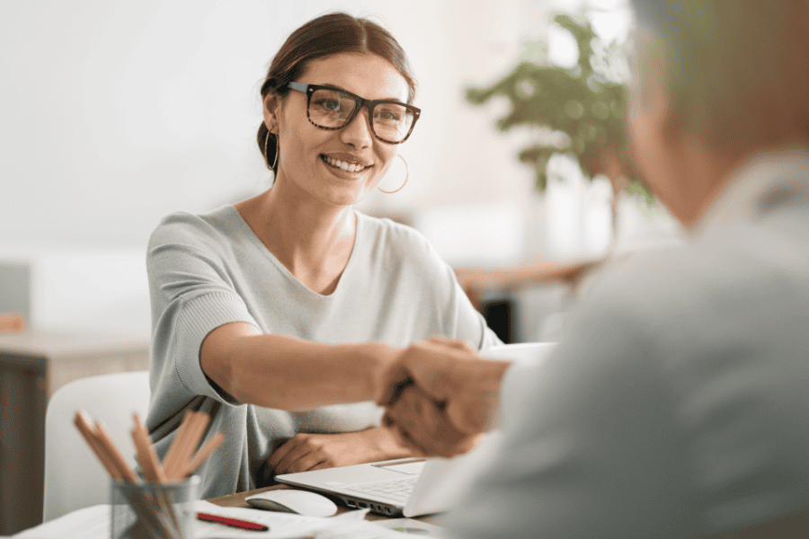 an independent contractor shaking hands with a recruiter