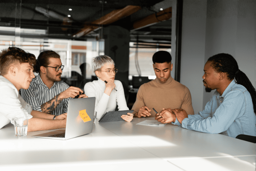 five diverse colleagues discussing setting up an entity in Mauritius