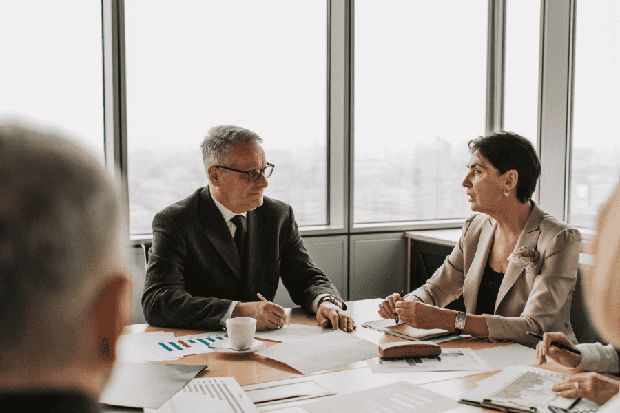 two colleagues talking about a shelf company in a meeting room