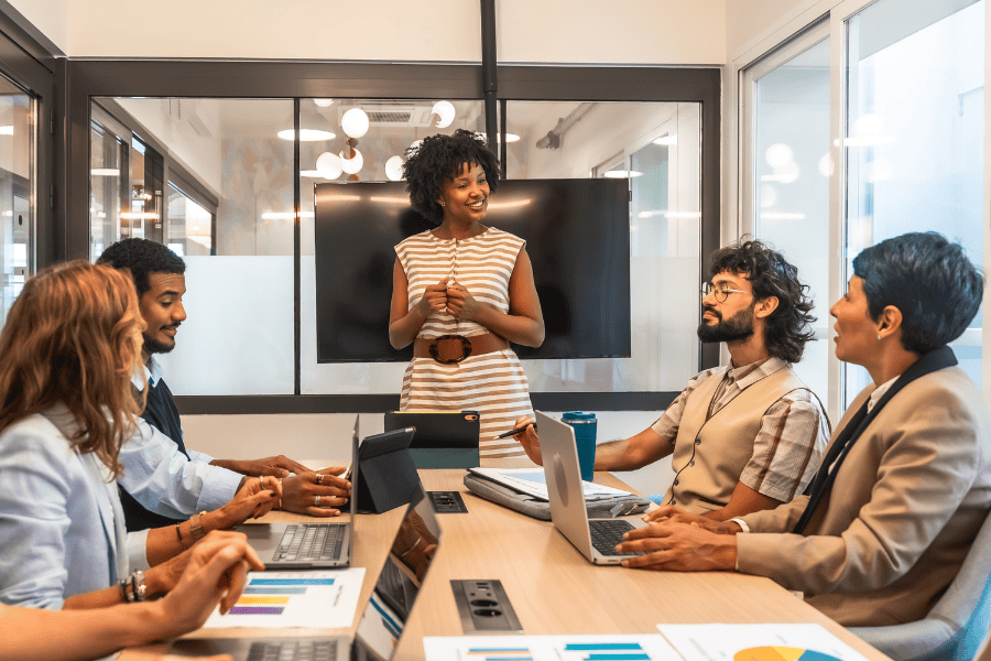 Diverse business team collaborating in a modern conference room.