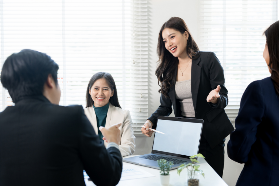 A group of professionals discussing about choosing an APAC regional HQ