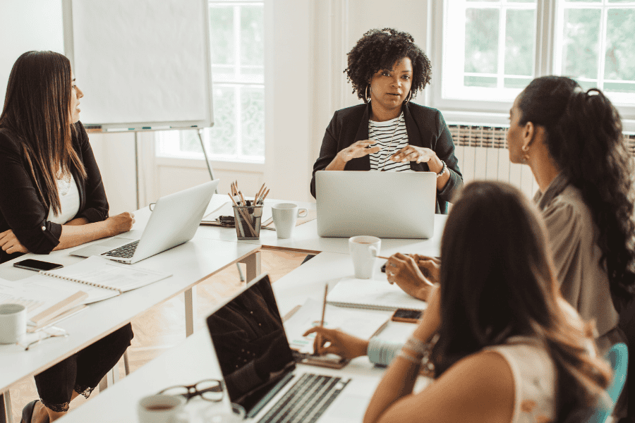 Diverse business team discussing strategies in a modern office.