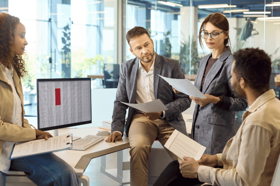 A finance team reviewing year-end tax reports.